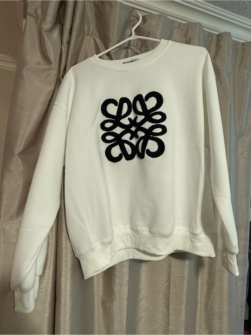 White Women's Crewneck Sweatshirt with Black Embroidered Logo